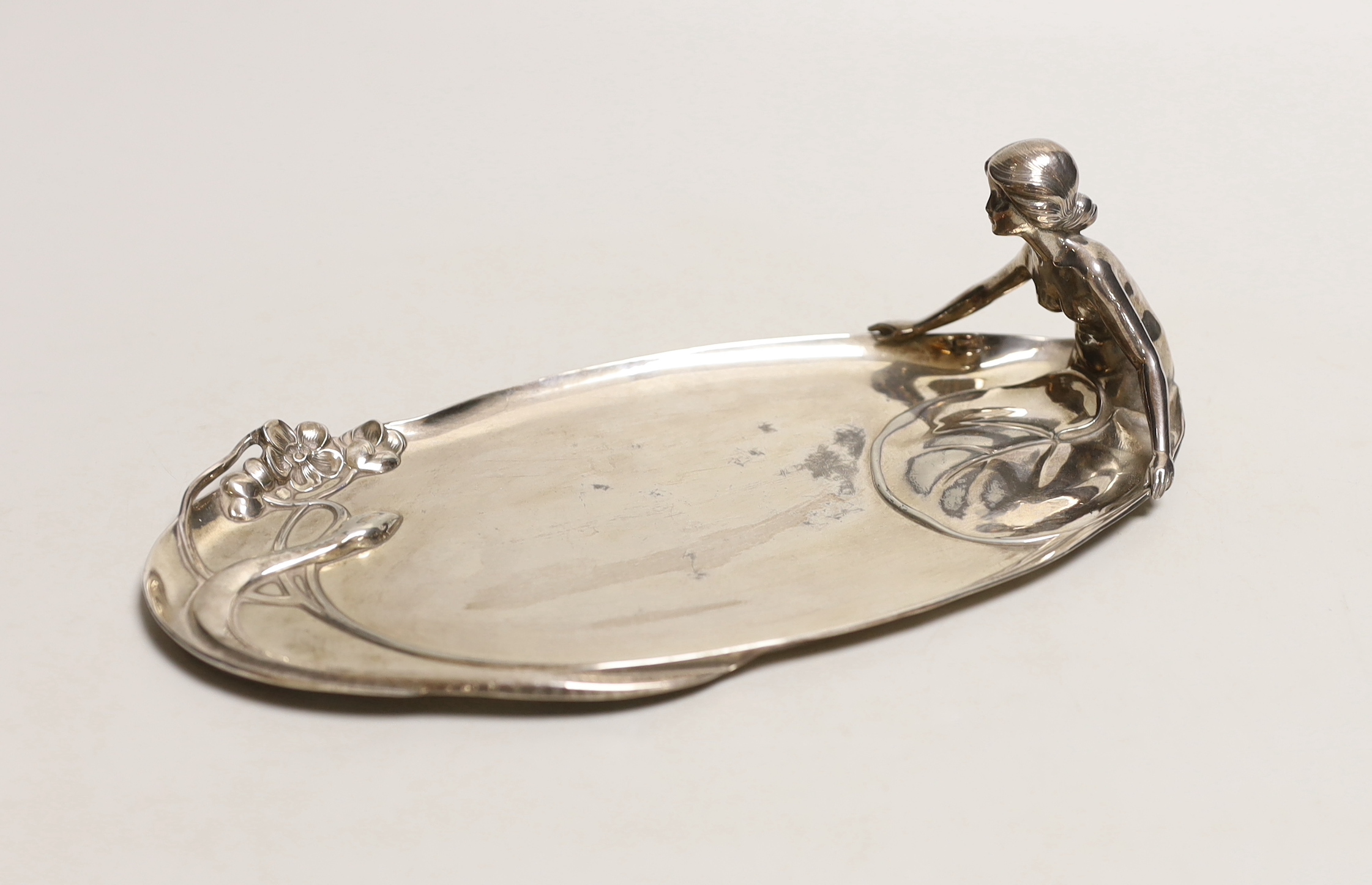 An Art Nouveau WMF (Wurttemburgerische Metallwarenfabrik) polished pewter figural tray, 25cm long